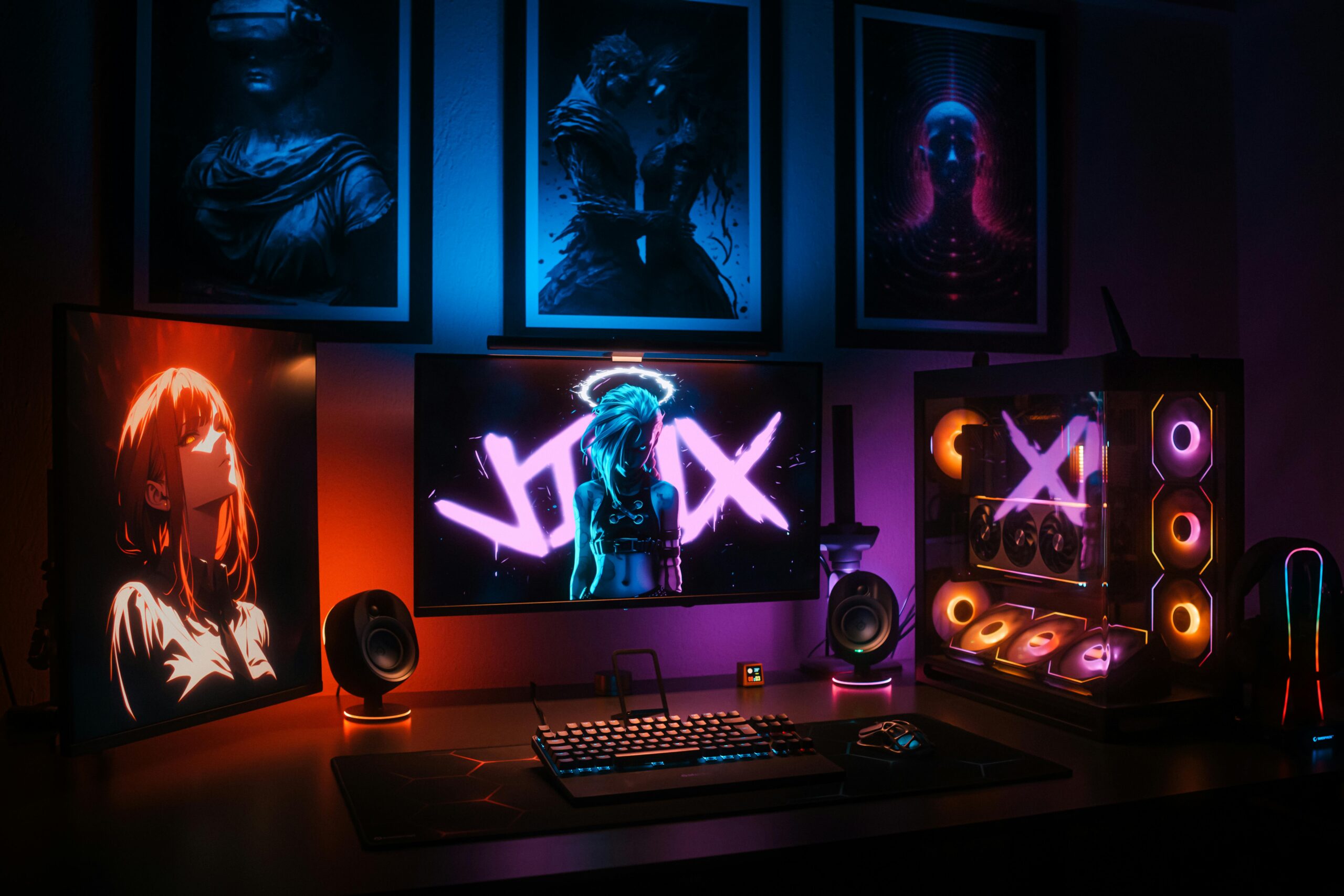 A vibrant gaming setup with neon lights, displays, and a custom PC in an artistic room.